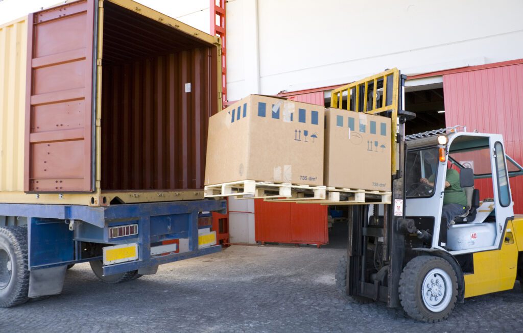 "Loading Pallets onto a Truck – Wholesale Distribution & Logistics"